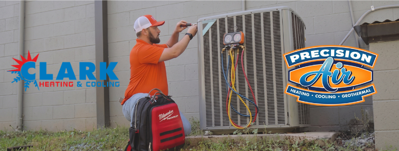 A technician in an orange shirt services an outdoor air conditioning unit with gauges. Clark Heating & Cooling and Precision Air logos are visible.